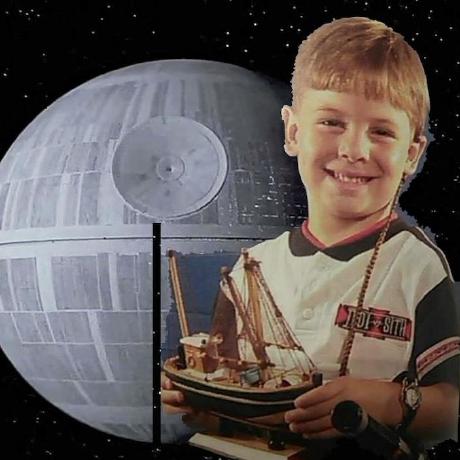 Alex Wallar as a kid, grinning and holding a model ship in front of the Death Star — his longtime GitHub avatar.